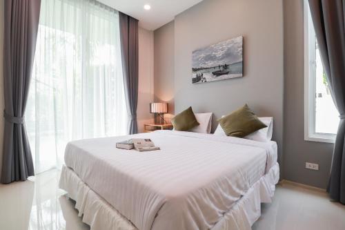 Tempat tidur dalam kamar di Chaum Haus Pool Villas