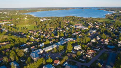 an aerial view of a small town next to a lake at Strandnäs Hotell in Mariehamn