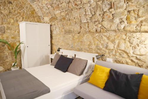 Giường trong phòng chung tại Girona Catedral