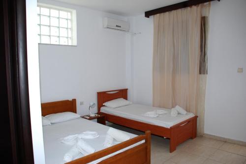 A bed or beds in a room at VILA NIKOLETA