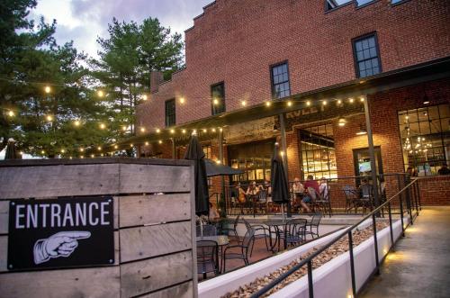 a restaurant with tables and chairs in front of a building at The Lofts at Downtown Salem in Salem
