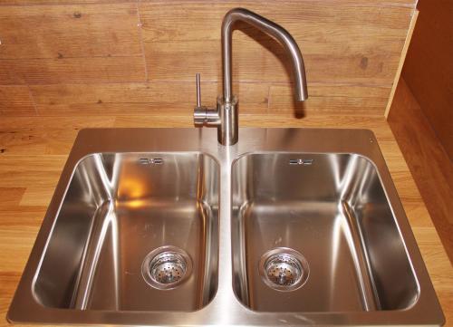 a stainless steel kitchen sink with a faucet at Aloe Friendly Holiday Home in Playa del Ingles