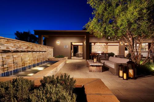a house with a patio with a couch and a table at The Nest Hotel Palo Alto in Palo Alto