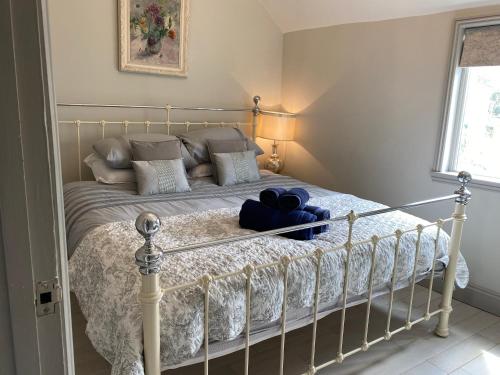 a bedroom with a bed with a teddy bear on it at Little Dolly sea view 2 bedroom apartment, St Ives town, dog friendly in St Ives