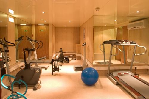 a gym with several exercise equipment in a room at Clifton Park Hotel - Exclusive to Adults in Lytham St Annes