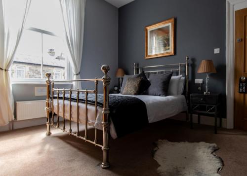 a bedroom with a bed and a window at Scotia House - Beautifully Presented Accommodation in Harrogate