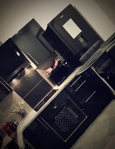 a kitchen with a counter top with a laptop on it at Loft 47 Spa in Chambly