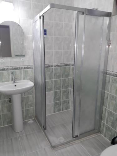 a bathroom with a shower and a sink at Aspawa Hotel in Pamukkale