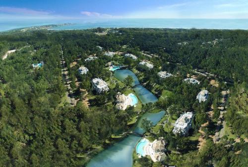 an aerial view of a resort with a river at Green Park Punta 2 in Punta del Este