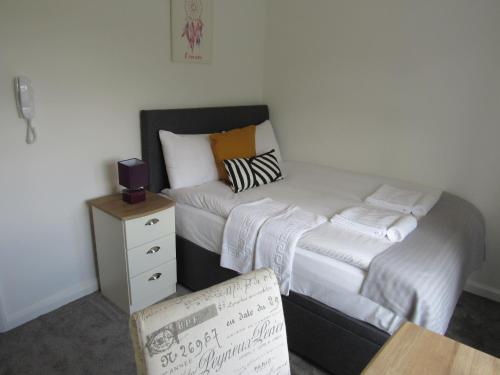 Ένα ή περισσότερα κρεβάτια σε δωμάτιο στο The Cambridge Suites - Tas Accommodations
