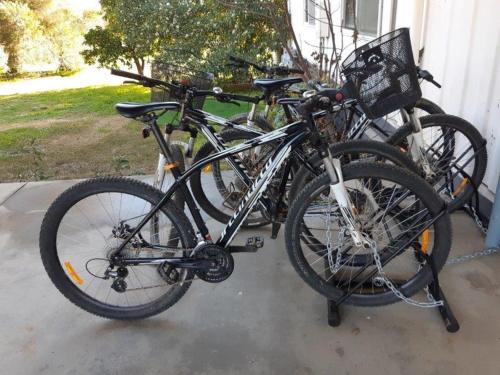 a group of bikes parked next to a house at Indigo Vineyard Farmstay in Beechworth