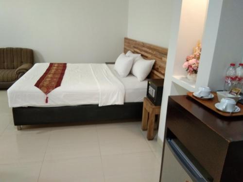 Postel nebo postele na pokoji v ubytování Antika Hotel