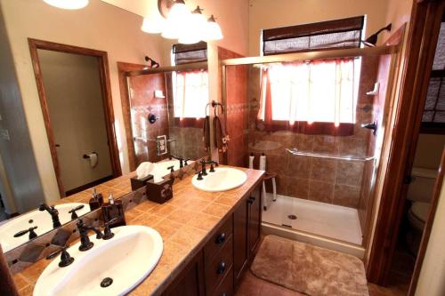 a bathroom with two sinks and a shower at Fairview 2 in Granby