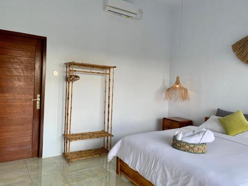 Postel nebo postele na pokoji v ubytování Pratama Guest House