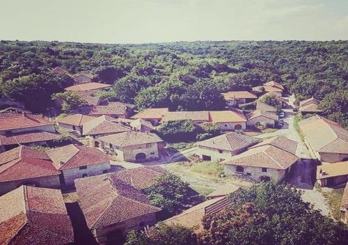 an aerial view of a village with roofs at Rajacke pivnice Country House C`est La Vie in Rajac