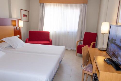 TV a/nebo společenská místnost v ubytování Hotel Canelas