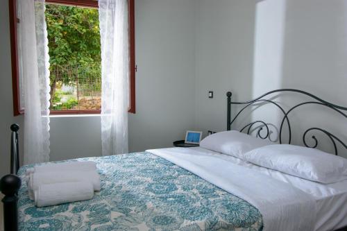 מיטה או מיטות בחדר ב-Pavlakis Lemon-Tree House