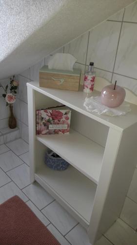 a white shelf in a bathroom with a sink at Gästehaus Alpenblick in Mutters