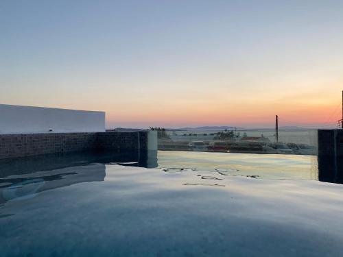 a view of a pool with snow on the roof at Eternal Suites in Mýkonos City