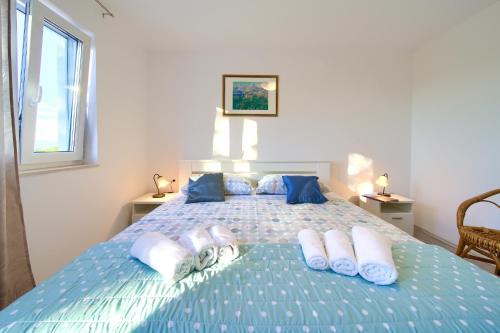 En eller flere senge i et værelse på Vila Vista