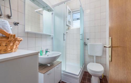 a bathroom with a toilet and a sink and a shower at Apartments Magdalena AS1 in Rovinj