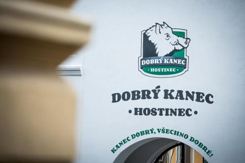a bottle of wine with a dog logo on it at Dobrý Kanec - Hostinec in Mělník