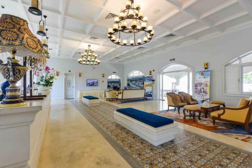 a large living room with a couch and a chandelier at Lan Rung Beach Resort in Long Hai