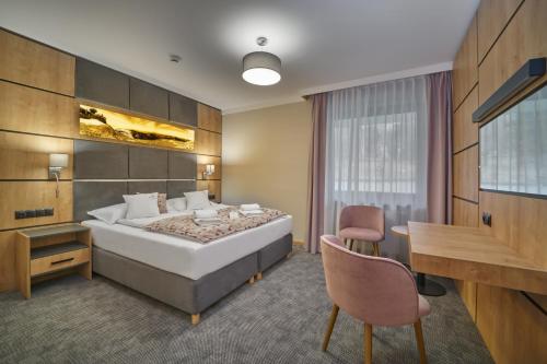 Postel nebo postele na pokoji v ubytování Artus Resort