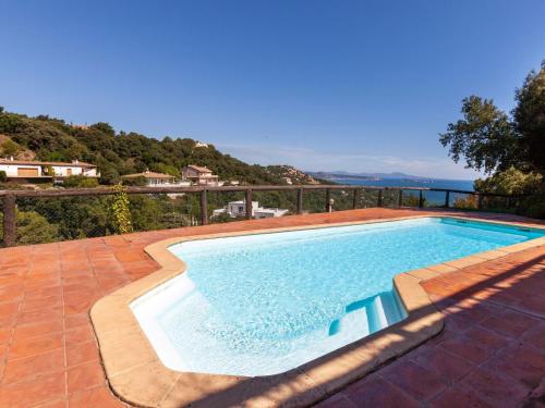 a swimming pool with a view of the ocean at Holiday Home Xarmada Cecilia by Interhome in Begur