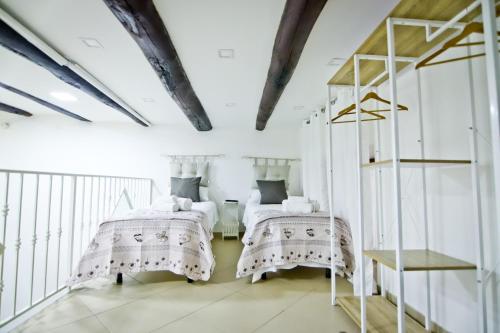 En eller flere senge i et værelse på Napulè - Loft