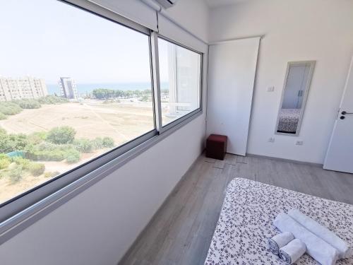 Postel nebo postele na pokoji v ubytování Mackenzie Seaview Paradise