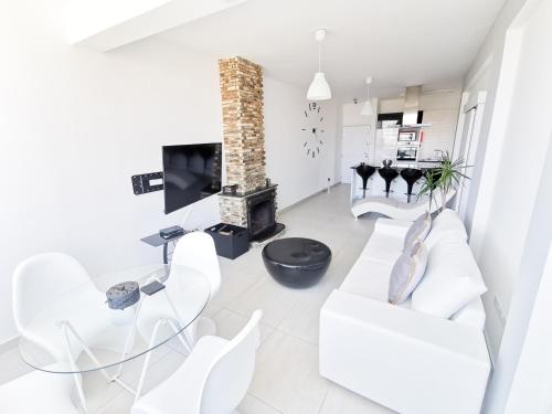 TV a/nebo společenská místnost v ubytování Mackenzie Seaview Paradise