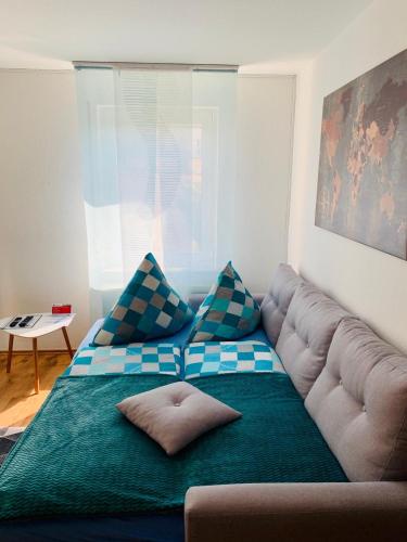 a couch in a living room with a blue and white at Apartment Saxonia in Pirna