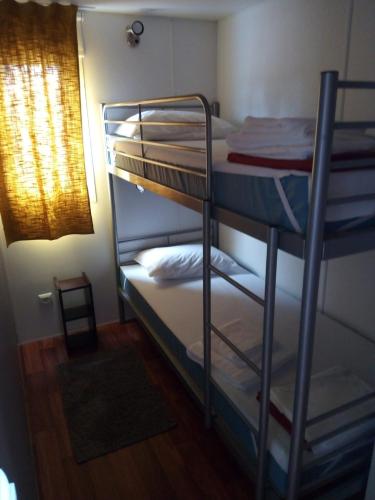 a couple of bunk beds in a room at Mira Lodge Park in Praia de Mira