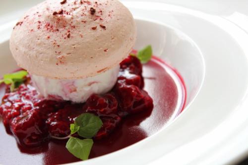 a dessert with a scoop of ice cream and cherries at Rufflets St Andrews in St. Andrews