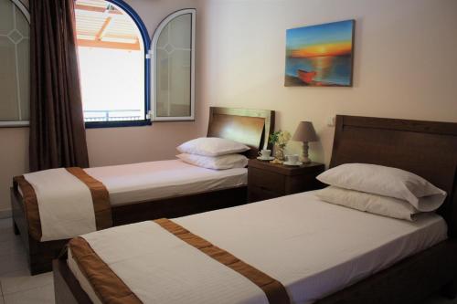 Ένα ή περισσότερα κρεβάτια σε δωμάτιο στο Sofia Apartments