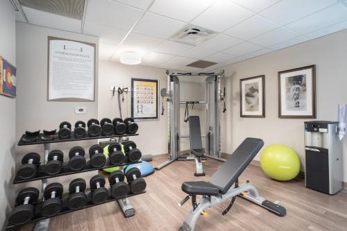a gym with dumbbells and weights in a room at Staybridge Suites Denver International Airport by IHG in Denver