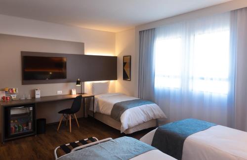 Cama o camas de una habitación en Intercity São Paulo Anhembi