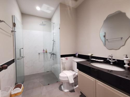 a bathroom with a toilet and a sink and a shower at The Castell Condo by Nutthiwan room 912 and 921 in Khao Kho