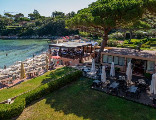 an aerial view of a resort with a restaurant and the water at Hotel Desiree in Procchio