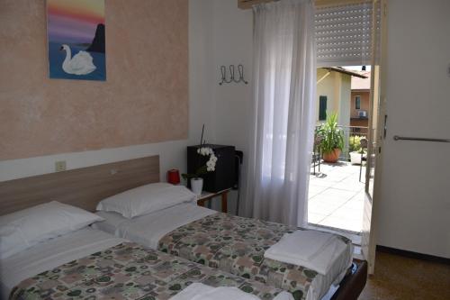 Postel nebo postele na pokoji v ubytování Villa Emma