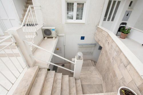 a set of stairs in a white building at Studios Lavender in Split