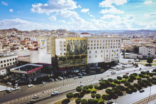 an aerial view of a city with buildings and traffic at Iridium Hotel in Taif