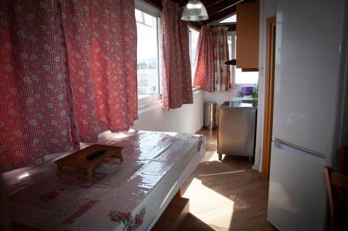 a living room with a table and a window at STAVROS amazing apartment in the centre of KOS in Kos Town