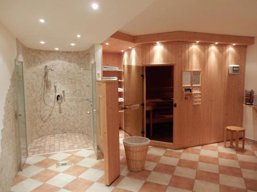 a large bathroom with a shower and a toilet at Ferienwohnung Cafe`Rotter , Brigitte und Jürgen Rotter in Schellerhau