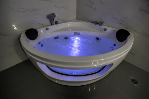 a bath tub with a face painted on it at Terra di Meteora Suites #1 in Kalabaka