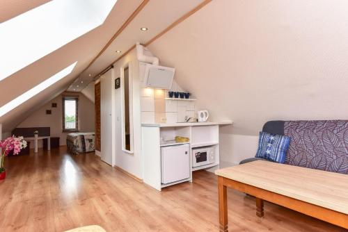 a living room with a couch and a table at "Trakaitis" nameliai in Trakai