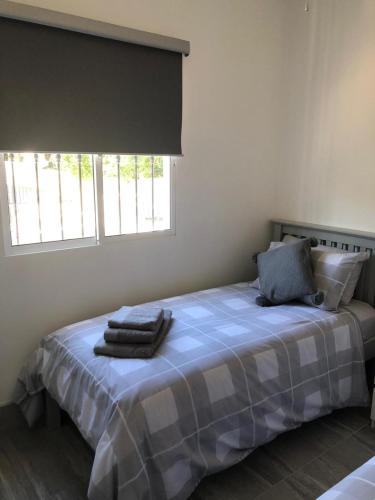 a bedroom with a bed with two towels on it at Casa Olivia villa in Arboleas