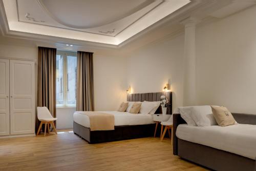 Postel nebo postele na pokoji v ubytování SM Vatican Relais B&B
