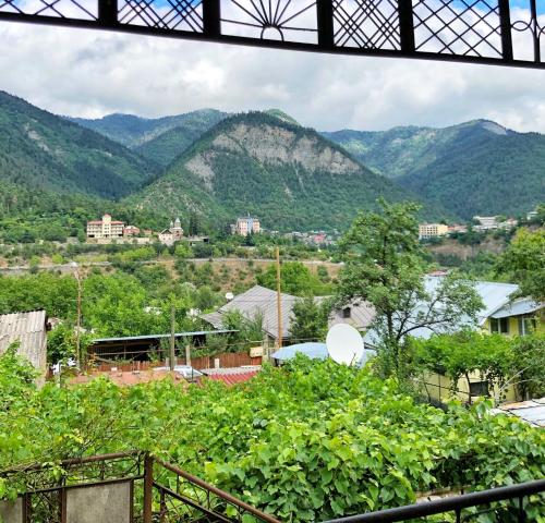 a view of a mountain range from a building at Achela's Guesthouse in Borjomi